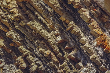 Detail of tectonic rock layers surface. Rock backgrounds and textures.