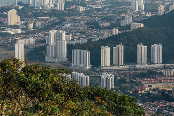 Fototapeta premium Cloudy sky, cityscape and mountain with green that viewed from Penang Hill at George Town. Penang, Malaysia.