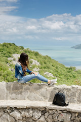woman with cellphone relax in mountains