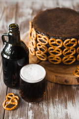 Сhocolate cake with ale decorated with salted pretzel