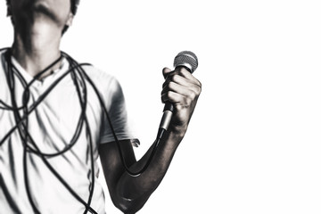 asian male singer holding microphone with hope & powerful, isolated on white. music background