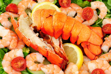 Cooked lobster tails with a fresh salad background