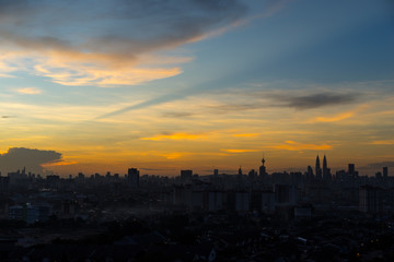 View of The Petronas Twin Towers during fiery sunset in Kuala Lumpur, Malaysia. Petronas are the tallest twin buildings in the world (451.9 m).