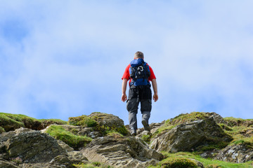 Fototapeta premium man on the hike on the top of the mountain