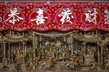 Fototapeta na wymiar An intricate carving of old Chinese history at entrance for GuanDi Temple, a Buddhist temple in the heart of metropolitan city of Kuala Lumpur, Malaysia.