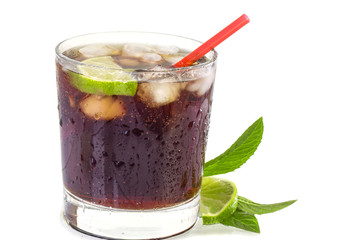 Cold sweet drink with cola ice in a glass