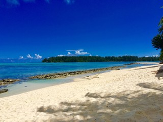 Beautiful white sanded beach and turquoise lagoon of Moorea, Tahiti, French Polynesia