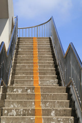 Overpass stairs in the city. Overpass walkway with blue sky background,Staircase of overpass
