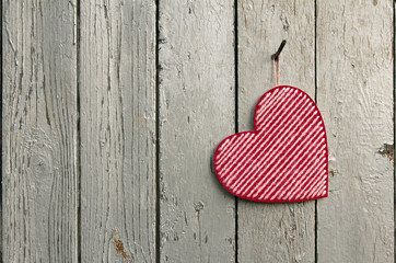 Valentines day background with heart on wooden background