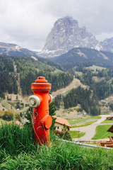 Fototapeta na wymiar Hydrant on the slope of the mountain