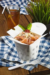 Carbonara with salmon in a box for fast food, pasta with fich.