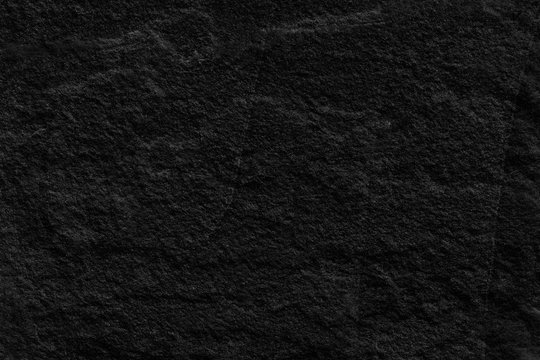 Dark grey black slate background or texture. black slate stone slab background or texture.