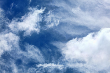 Cloudscape background of dramatic cirrus and cumulus clouds