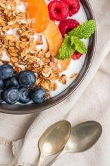 Yogurt with baked granola and berries