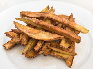 Aubergine strips baked and cooked in honey and served as a tapas type snack to share in Ayamonte, Andlaucia, Spain.