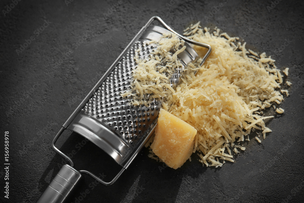 Wall mural Grater and cheese on table