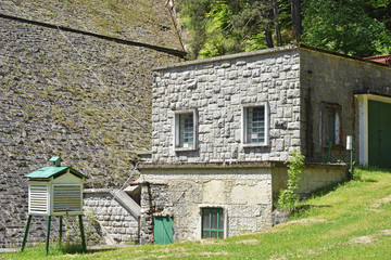 Fototapeta na wymiar Building made of stones near water barrage
