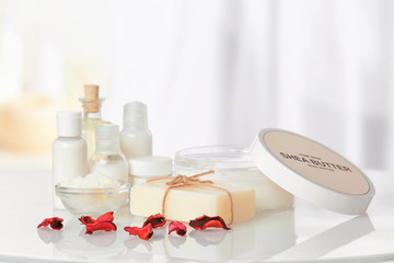 Composition of Shea butter with cosmetic products on table