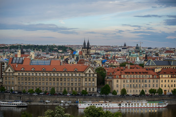 Naklejka na ściany i meble Panorama of Prague with Red Roofs from Above Summer Day at Dusk, View from the height