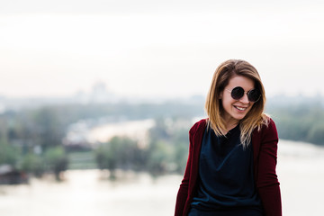 Outdoors portrait of young woman smiling