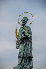 Saint John of Nepomuk on the famous charles bridge in prague