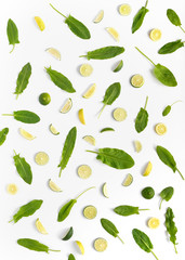 Pattern of citrus. Sorrel, slices of lemon and lime isolated on white background. Abstract food background.