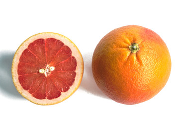 Closeup of red grapefruits on a white background