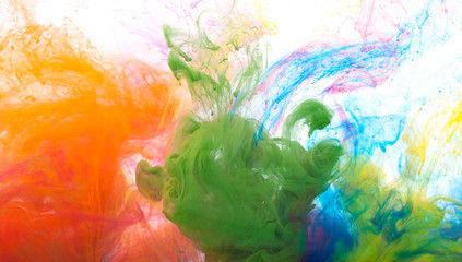 Abstract colored ink in the water as smoke, isolated on white background