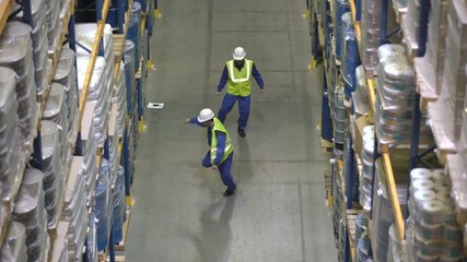 Warehouse workers have dance battle during break in storehouse