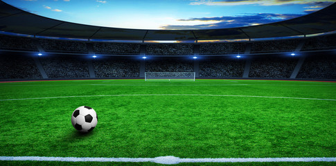 Soccer ball on green stadium