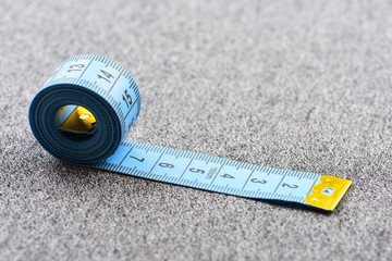 Tape for measuring on light grey background