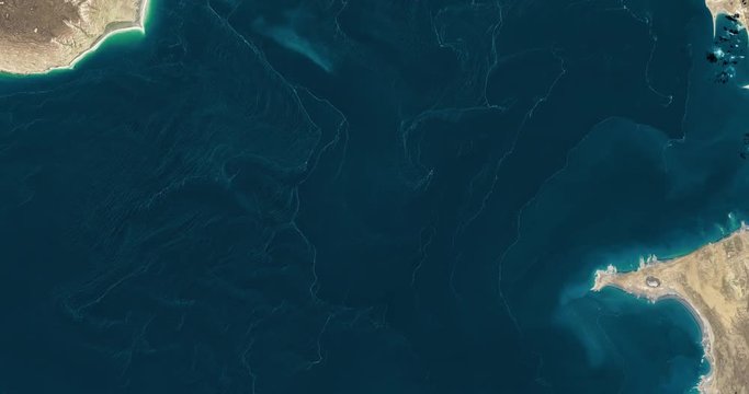 High-altitude overflight aerial of Garabogazkol lagoon, near the Caspian Sea, Turkmenistan. Clip loops and is reversible. Elements of this image furnished by USGS/NASA Landsat