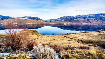 Kamloops Lake, which is a very wide portion of the Thompson River, on a cold winter day with the...