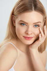 Fototapeta premium Woman Beauty Face. Portrait Girl With Soft Skin, Natural Makeup