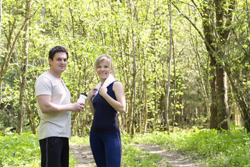 Athletic man and woman after fitness exercise