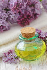Fototapeta na wymiar Lilac essential aroma oil