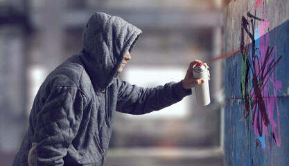 Guy drawing with spray