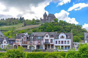 Street view with romantic houses of Bacharach /  Rhine and castle Stahleck. Rhineland-Palatinate. Germany.