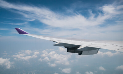 Obraz premium A view from the airplane. The aircraft is flying through the clouds.Air travel concept.