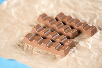 Chocolate bars on the wrinkled brown paper