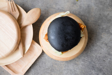 Black burger with Chicken and lettuce