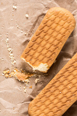 Flat lay above brown biscuit cookies on the wrinkled paper