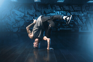 Breakdance motions, performer in dance studio