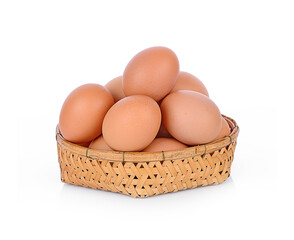  eggs in basket on white background