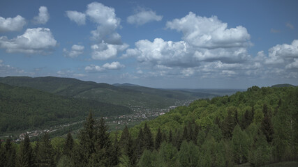 The mountain landscape on the background of the town