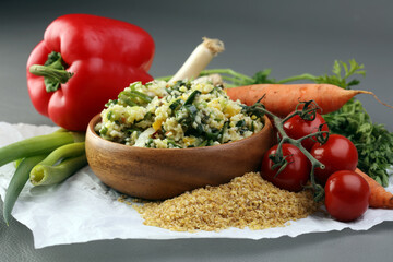 Tabbouleh salad with bulgur, parsley and vegetables -diet concept