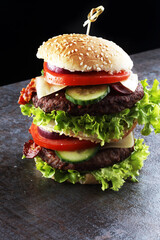 fresh tasty burger on wooden grey background