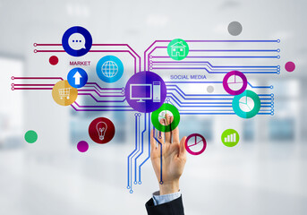 Modern office interior and close of businesswoman hand choosing icon on multimedia interface
