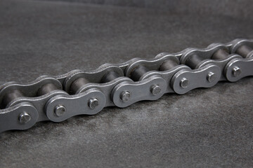 Industrial driving roller chain. Part of the chain drive of machine-building mechanism.