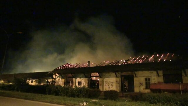 old warehouse burning at night